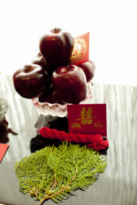 Red apples and red Chinese envelopes decoration on a table