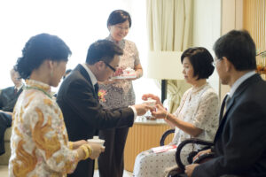 Bride and groom serving tea