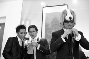 Groomsman wearing a faux dog hood