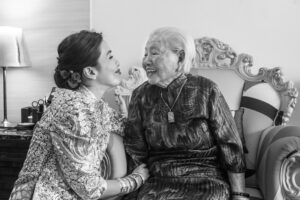 Bride with her grandmother sharing a private joke